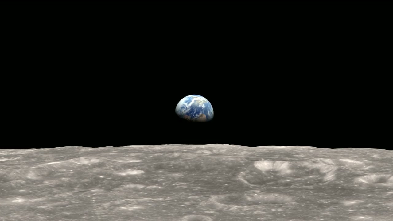 Earth rising above the cratered lunar horizon in a NASA visualization